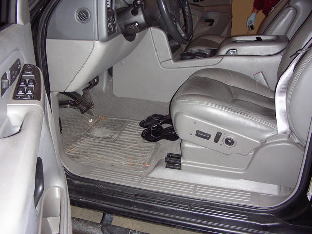 Tina's sandals were placed perfectly, side by side, on the floor of the front driver's area. 