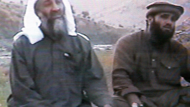 This frame grab from the Saudi-owned television network Middle East Broadcasting Center shows terror mastermind Osama bin Laden sitting with Sulaiman Abu Ghaith, the spokesman of his al Qaeda network, in an undated videotape broadcast by the Dubai-based M 