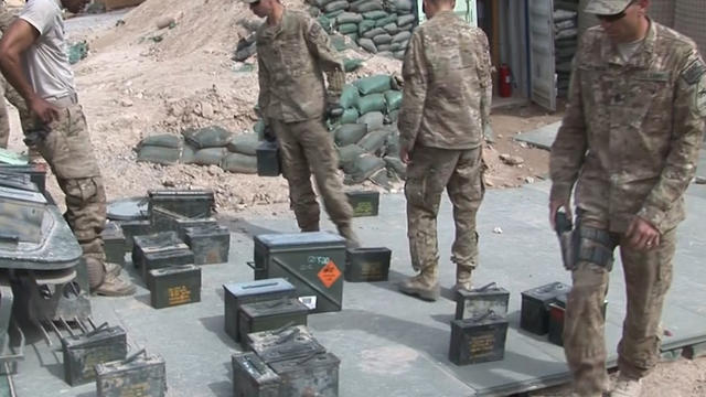 U.S. soldiers pack up equipment as they prepare to leave Combat Outpost Timothy Johnson 