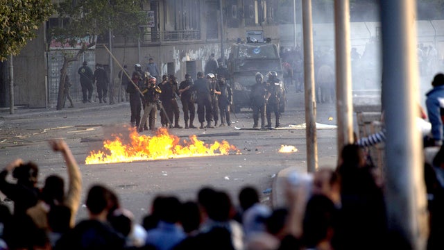 Egyptian protesters clash with riot police in downtown Cairo, Egypt, Saturday, March 9, 2013. 