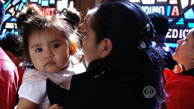A mother and child at the Saint Athansius Church in Brooklyn. 