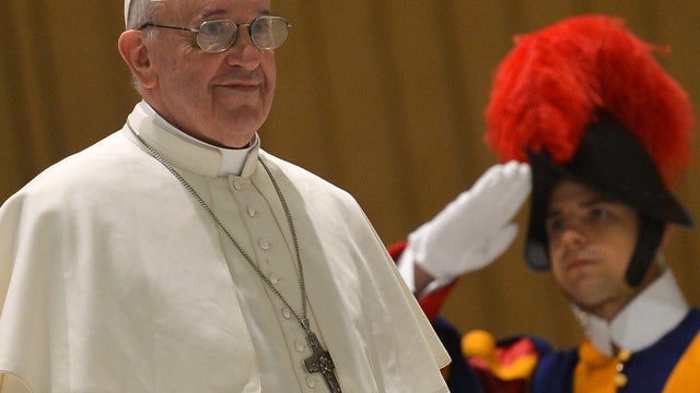 Pope Francis arrives for an audience with members of the media March 16, 2013, at Paul VI Hall at the Vatican. 