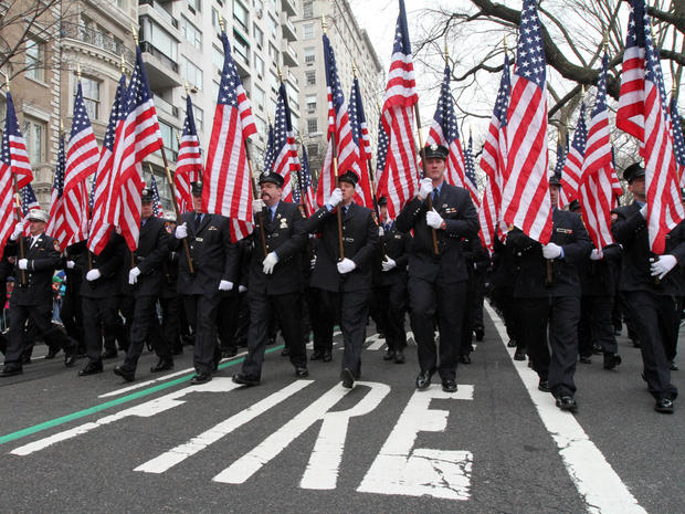 Holding flags in memory of the 343 firefighters who lost their lives in the Sept. 11, 2001, attacks, members of the New York City Fire Department make their way up New York's Fifth Avenue as they take part in the St. Patrick's Day Parade March 16, 2013. 