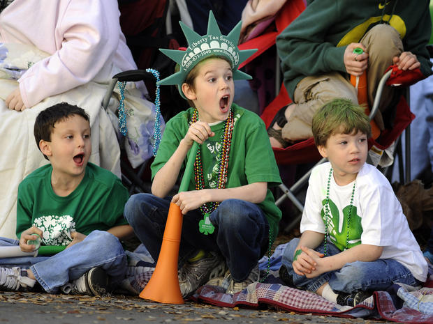Jacob Tidwell, center, and his friends Donavan Mock, left, and Preston Vasquez react to a band during Savannah's 189-year-old St. Patrick's Day parade March 16, 2013, in Savannah, Ga. Started in 1824 by early Irish immigrants to Georgia, the parade has ba 
