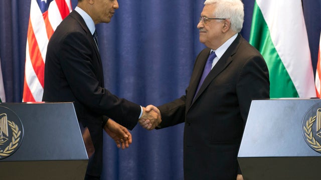 President Obama and Palestinian President Mahmoud Abbas shake hands during a joint news conference at the Muqata Presidential Compound in the West Bank town of Ramallah March 21, 2013. 