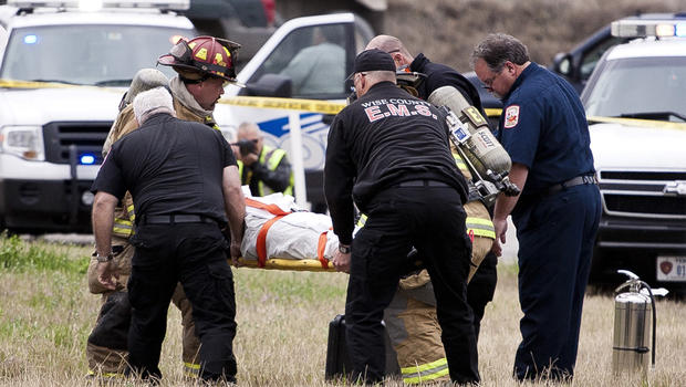 Suspect is carried on a stretcher following a car chase and crash in northern Texas. 