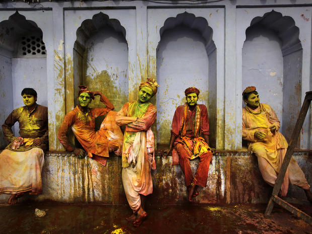 Indian villagers from Nandgaon, India, wait for the arrival of villagers from Barsana to celebrate Lathmar Holi at the Nandagram temple, famous for Lord Krishna and his brother Balram, in Nandgaon, 75 miles from New Delhi, March 22, 2013. During Lathmar H 