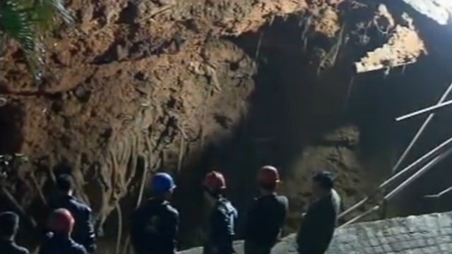 The sinkhole in Shenzhen city, southern China, that swallowed up a man on March 26th, 2013. 