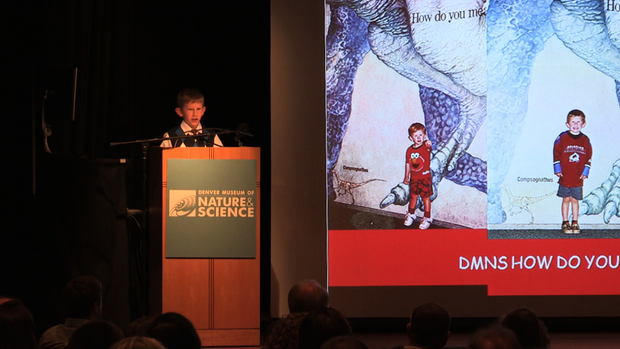 Eli Navant, 9, gives a speech at the conclusion of his day as curator of the Denver Museum of Nature and Science. 