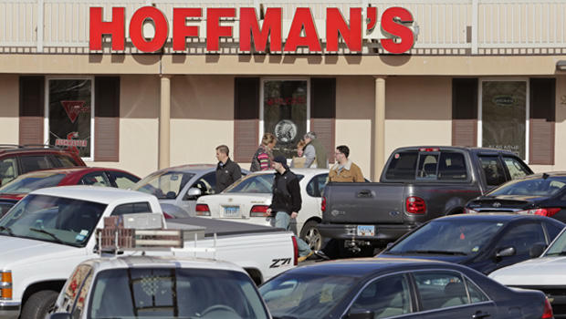 Cars jam the parking lot as shoppers leave Hoffman's Gun Center with their purchases in Newington, Conn., Tuesday, April 2, 2013. Customers are packing gun stores around Connecticut following the unveiling of new gun-control legislation, which could take effect as soon as Wednesday evening. 