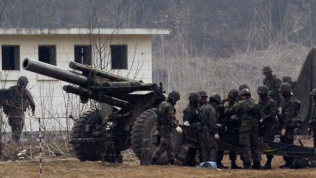 South Korean soldiers prepare to fire 155 mm howitzers during their military exercise in the border city between two Koreas, Paju, north of Seoul, South Korea, Friday, April 5, 2013.  