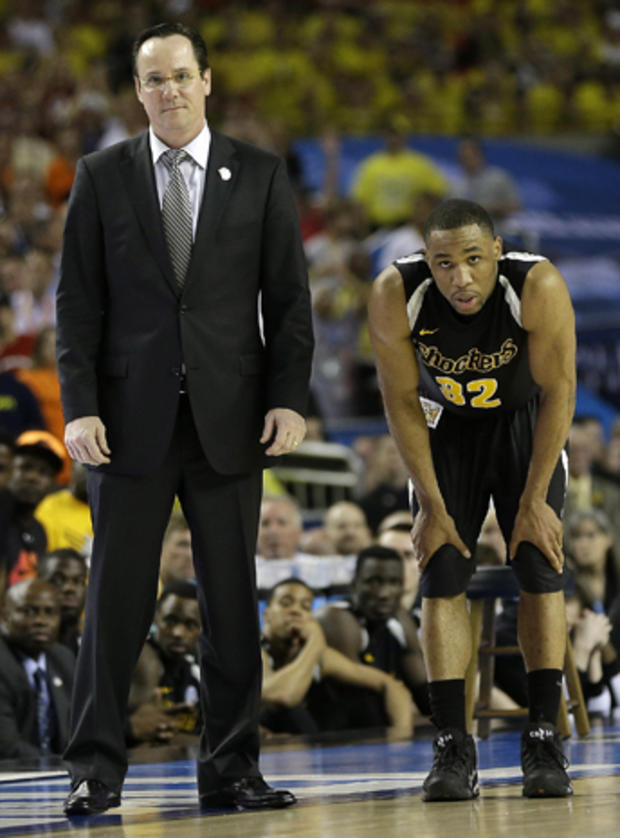 Wichita State head coach Gregg Marshall and Wichita State's Tekele Cotton watch during the second half of a NCAA Final Four tournament college basketball semifinal game against Louisville April 6, 2013, in Atlanta. Louisville won 72-68. 