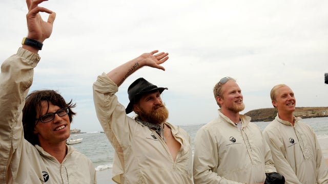 American Pat Fleming, American Jordan Hanssen, Canadian Adam Kreek and Canadian Markus Pukonen pose on January 23, 2012 on Ngore beach outside Dakar before attempting to row across the Atlantic to reach Miami, Florida, aboard an 8.8 meter long boat. 