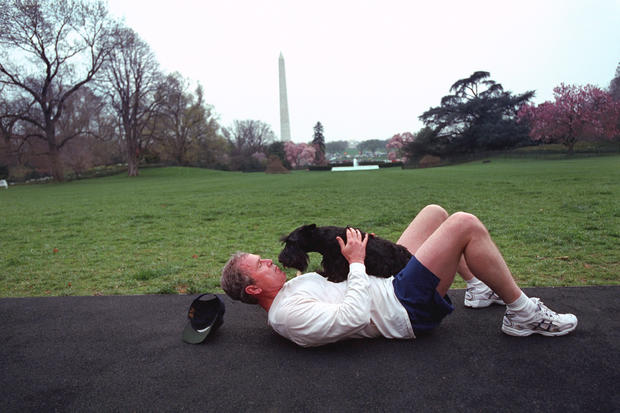 Bush_laying_on_south_lawn_with_dog_(Pg._50-51)_1.jpg 