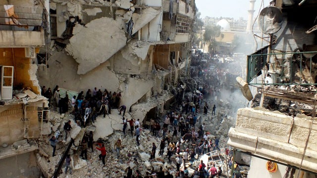 Residents search rubble in Aleppo after government air strike 