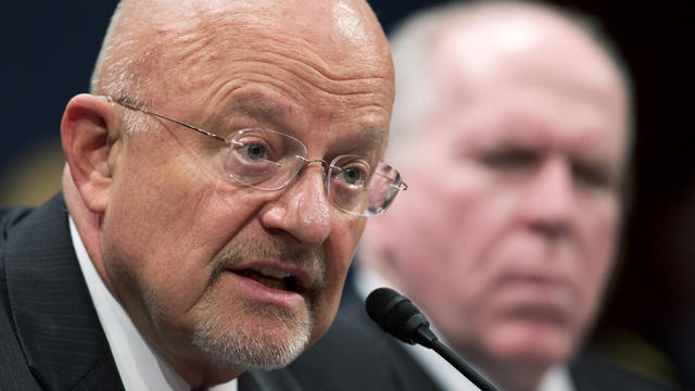 National Intelligence Director James Clapper, left, accompanied by CIA Director John Brennan, testifies on Capitol Hill in Washington April 11, 2013, before the House Intelligence Committee hearing on worldwide threats. 