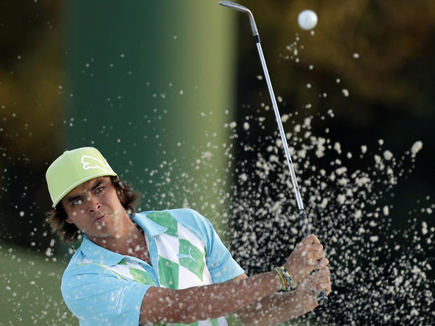 Rickie Fowler hits out of a bunker to the 18th hole during the second round of the Masters golf tournament April 12, 2013, in Augusta, Ga. 