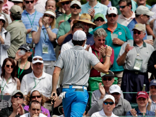 Rory McIlroy, of Northern Ireland, holds up his ball after putting on the sixth green during the second round of the Masters golf tournament April 12, 2013, in Augusta, Ga. 