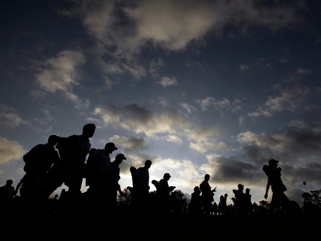 Spectators make their way to Augusta National Golf Club for the second round of the Masters golf tournament April 12, 2013, in Augusta, Ga. 