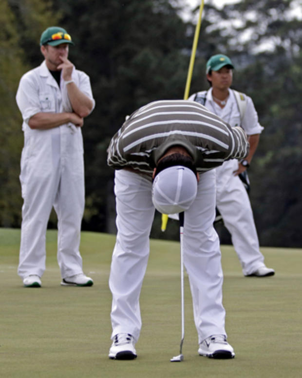 Francesco Molinari, of Italy, reacts after missing a putt on the 18th hole during the first round of the Masters golf tournament April 11, 2013, in Augusta, Ga. 