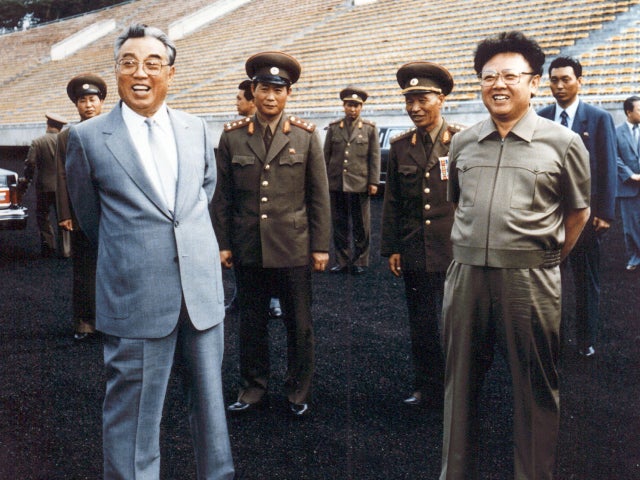 Former North Korean leaders Kim Jong-Il (R) and his father, Kim Il-Sung