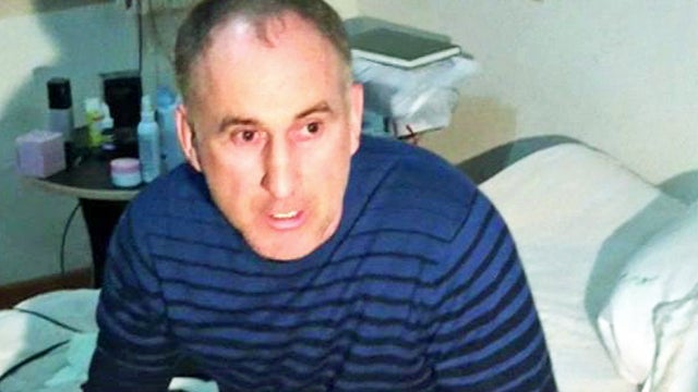 In this image taken from a mobile phone video, the father of USA Boston bomb suspects, Anzor Tsaraev reacts as he talks to the media about his sons, in his home in the Russian city of Makhachkala, Friday April 19, 2013. One son is now dead, and one son Dz 