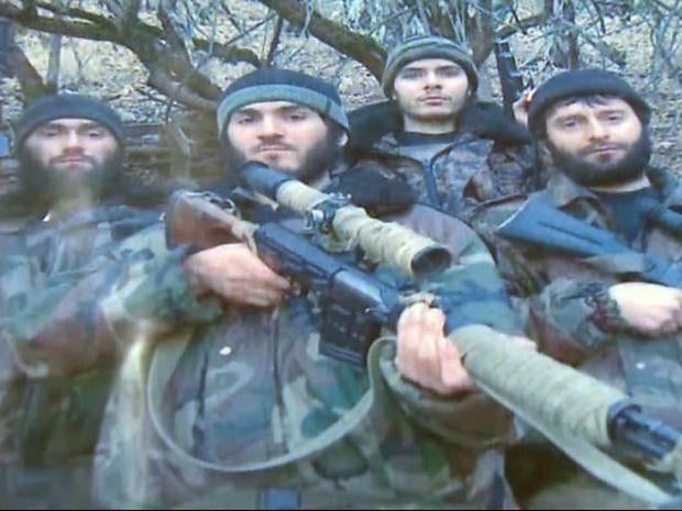 William Plotnikov, (third from left), is pictured in this undated photo with Islamist extremists in Dagestan. 