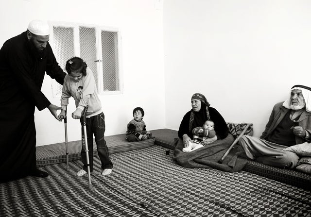 Isra, 9, was left unable to walk by a sniper's bullet 