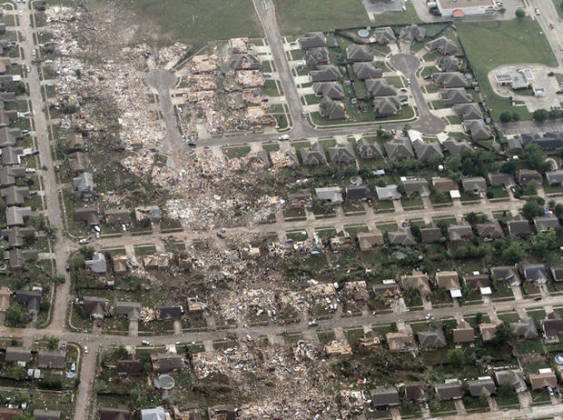 This aerial photo shows the remains of homes hit by a massive tornado in Moore, Okla., Monday May 20, 2013. 