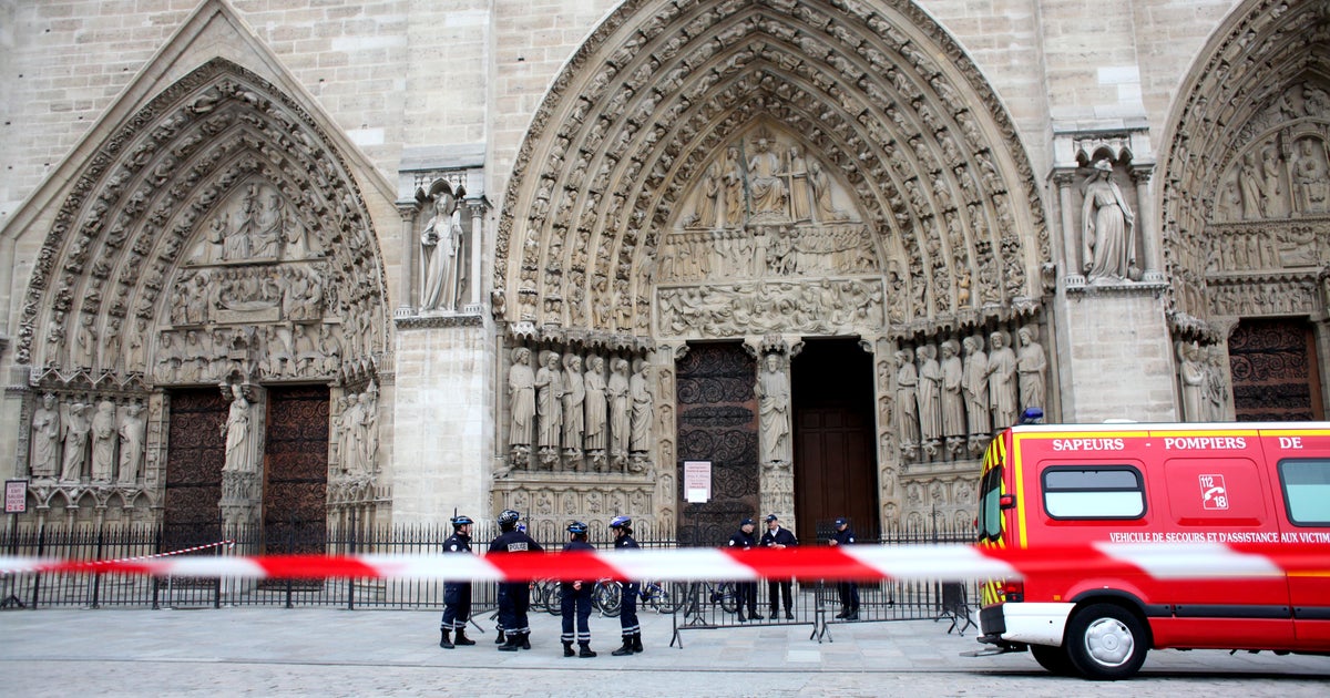 Visitors evacuate after suicide at Paris' Notre Dame Cathedral CBS News