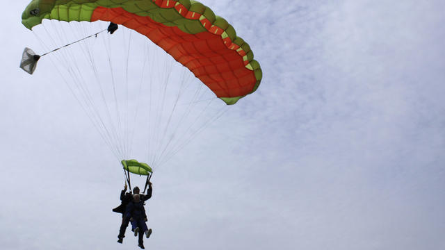Clarence Turner and instructor Jeff McGinnis parachute into the Red Stewart Airfield near Waynesville, Ohio, Saturday, May 25, 2013. 