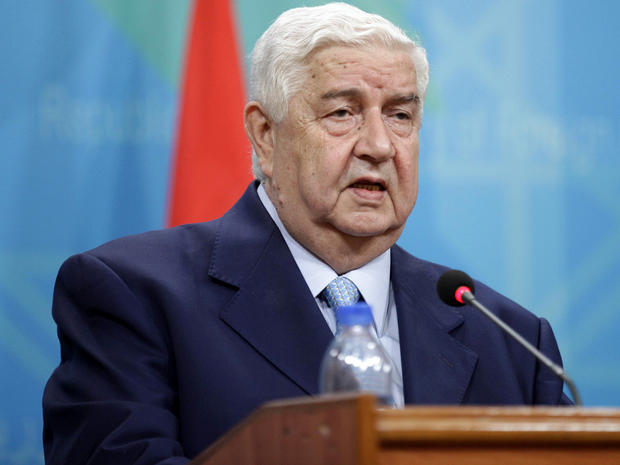 Syrian Foreign Minister Walid al-Moallem attends a press conference with his Iraqi counterpart, Hoshyar Zebari, not pictured, in Baghdad, Iraq, May 26, 2013. 