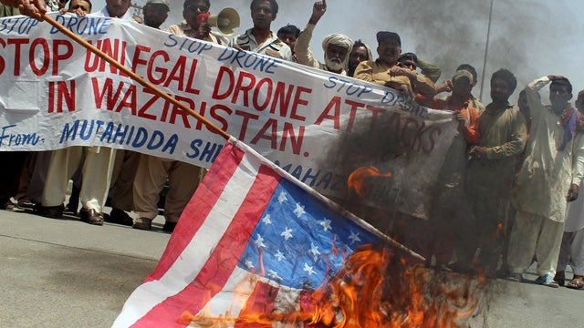 Pakistani protesters burn a representation of a U.S. flag May 30, 2013, in Multan, Pakistan, to condemn a suspected drone attack in the Pakistani tribal area of Waziristan that killed Taliban leader Waliur Rehman. 