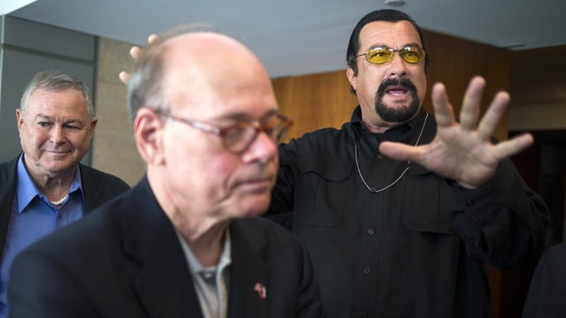 Rep. Dana Rohrabacher, left, who is leading a U.S. Congressional delegation to the Russian Federation, Rep. Steven Cohen, center, and U.S. actor Steven Seagal, right, speak to the media after a news conference in U.S. Embassy in Moscow, Russia, Sunday, Ju 