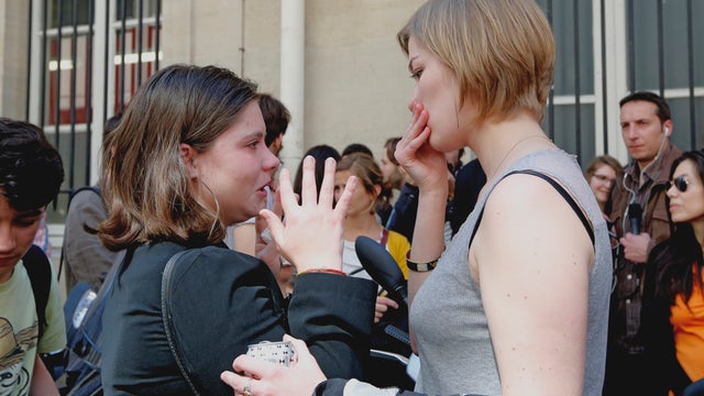 Unidentified students of the Institut d'etudes Politiques, also known as Sciences Po, in Paris react over the death of a fellow student 