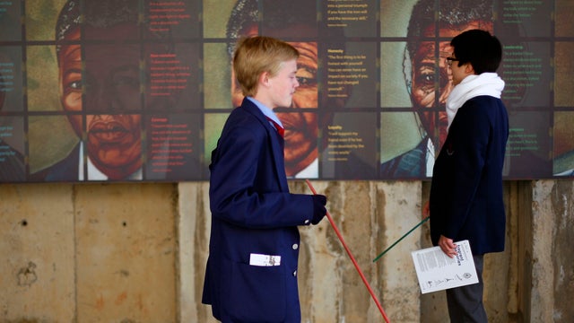South African pupils at a temporary exhibit on Nelson Mandela at the Apartheid Museum 