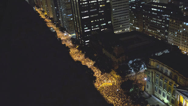 Protestors march in Rio de Janeiro, Brazil, Monday, June 17, 2013. Protests in Sao Paulo, Rio de Janeiro and other Brazilian cities, set off by a 10-cent hike in public transport fares, have clearly moved beyond that issue to tap into widespread frustration in Brazil about a heavy tax burden, politicians widely viewed as corrupt and woeful public education, health and transport systems and come as the nation hosts the Confederations Cup soccer tournament and prepares for next month's papal visit. 