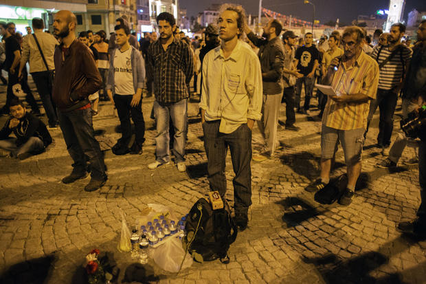 Turkish choreographer Erdem Gunduz (center) stands on Istanbul's Taksim Square 