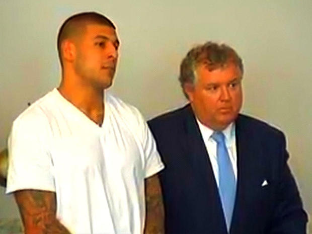 New England Patriots tight end Aaron Hernandez and his attorney, Michael Fee, appear in Attleboro District Court in Attleboro, Mass., June 26, 2013. 