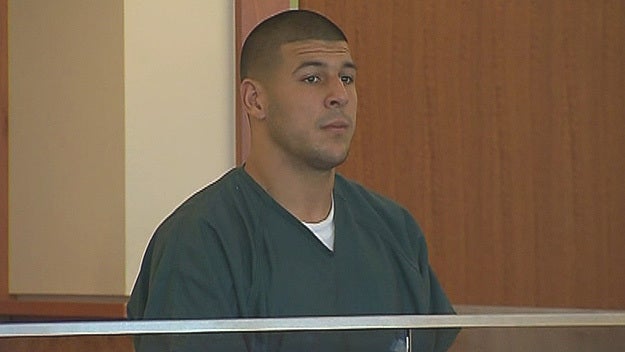 New England Patriots tight end Aaron Hernandez, left, stands with his attorney, Michael Fee, right, in Attleboro District Court June 26, 2013, in Attleboro, Mass. 
