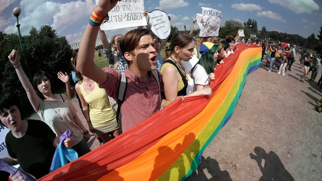 Gay rights activists shout slogans during a rally in St. Petersburg, Russia 