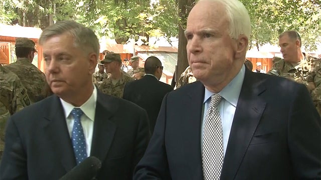 Republican U.S. Senators Lindsey Graham (left) and John McCain speak to reporters in Kabul 