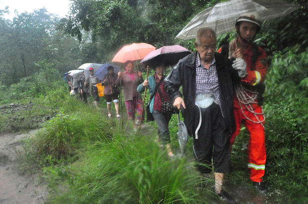 Rescuers evacuate residents from landslide-hit areas in Dujiangyan 