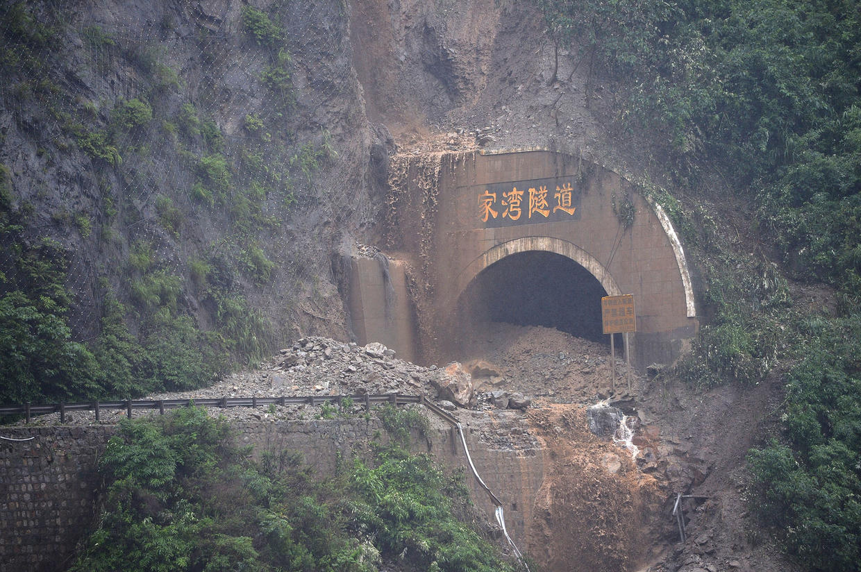 China floods sweep away bridges, houses and hillsides, killing at least ...