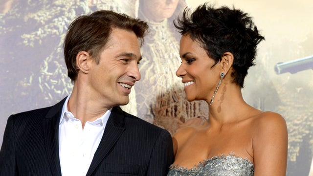 Actress Halle Berry (R) and actor Olivier Martinez arrive at the premiere of Warner Bros. Pictures' "Cloud Atlas" at the Chinese Theatre on October 24, 2012 in Los Angeles, California.  