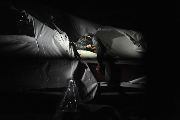 Dzhokhar Tsarnaev is seen on a boat in Watertown, Mass., at the conclusion of a nearly 24-hour-long manhunt on April 19, 2013. 