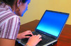 611px-Woman-typing-on-laptop2.jpg 