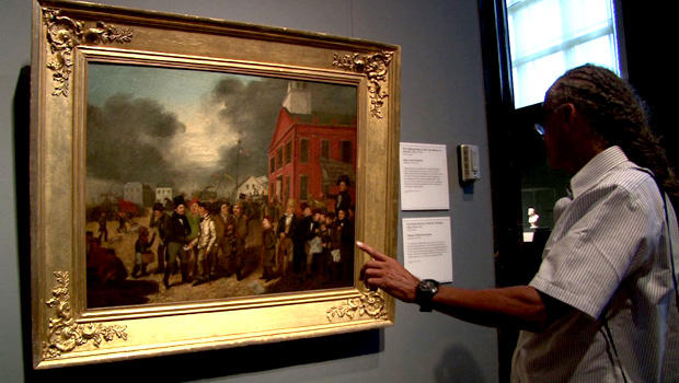 A man looks at an 1837 painting by Burnham Thomas Mickell at the Detroit Institute of Arts. 