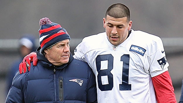 New England Patriots tight end Aaron Hernandez, left, stands with his attorney, Michael Fee, right, during a hearing in Attleboro District Court June 26, 2013, in Attleboro, Mass. 