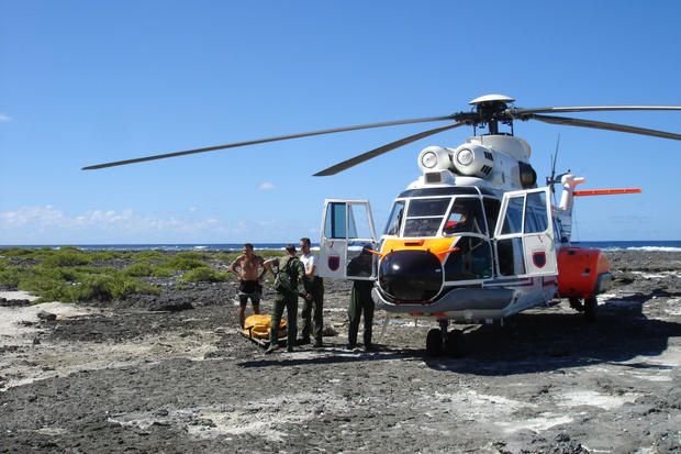 The French Navy helicopter arrives on the reef to airlift the Silverwoods to Bora Bora. It took the helicopter all morning to reach them due to their remote location. 